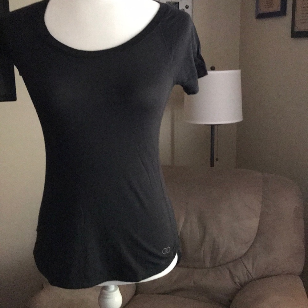 Calia short sleeved black top in XS..hi/low